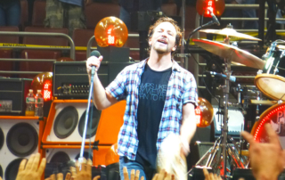 An image of Eddie Vedder performing live, as part of the dream Pearl Jam setlist article from Skipped on Shuffle.