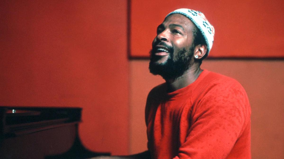 An Image of soul singer Marvin Gaye sitting at a piano.